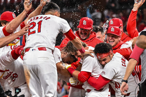 ST. LOUIS, MO - APRIL 22: St. Louis Cardinals second base Nolan Gorman (16) is greeted at home by his teammates to celebrate his two run walk off home run in the bottom of the ninth during a game between the Arizona Diamondbacks and the St. Louis Cardinals on Monday April 22, 2024, at Busch Stadium in St. Louis MO (Photo by Rick Ulreich/Icon Sportswire)