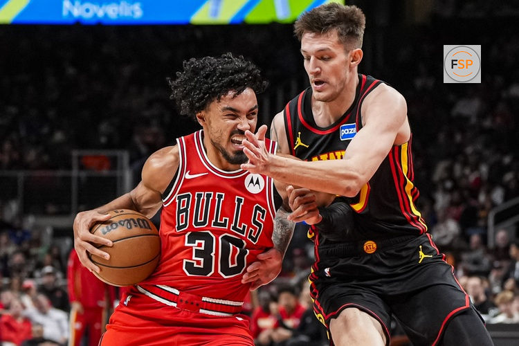 Dec 21, 2025; Atlanta, Georgia, USA; Chicago Bulls guard Tre Jones (30) is defended by Atlanta Hawks guard Vit Krejci (27) during the second half at State Farm Arena. Credit: Dale Zanine-Imagn Images