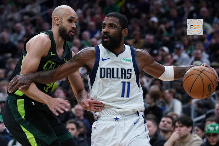Feb 6, 2025; Boston, Massachusetts, USA; Dallas Mavericks guard Kyrie Irving (11) drives the ball against Boston Celtics guard Derrick White (9) in the first quarter at TD Garden. Credit: David Butler II-Imagn Images