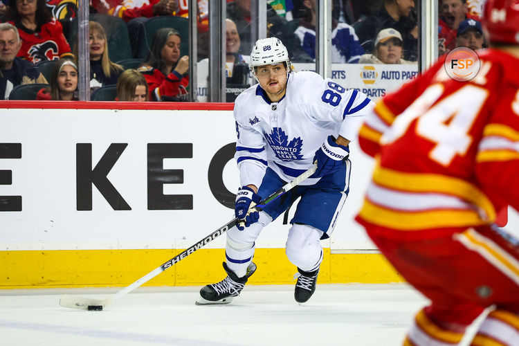 Feb 4, 2025; Calgary, Alberta, CAN; Toronto Maple Leafs right wing William Nylander (88) controls the puck against the Calgary Flames during the third period at Scotiabank Saddledome. Credit: Sergei Belski-Imagn Images