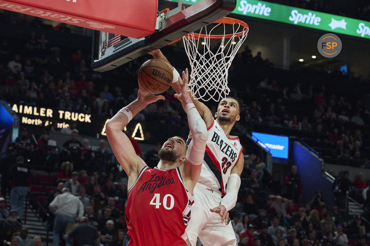 Jan 16, 2025; Portland, Oregon, USA; Portland Trail Blazers forward Toumani Camara (33) blocks a shot against LA Clippers center Ivica Zubac (40) during the first half at Moda Center. Credit: Troy Wayrynen-Imagn Images