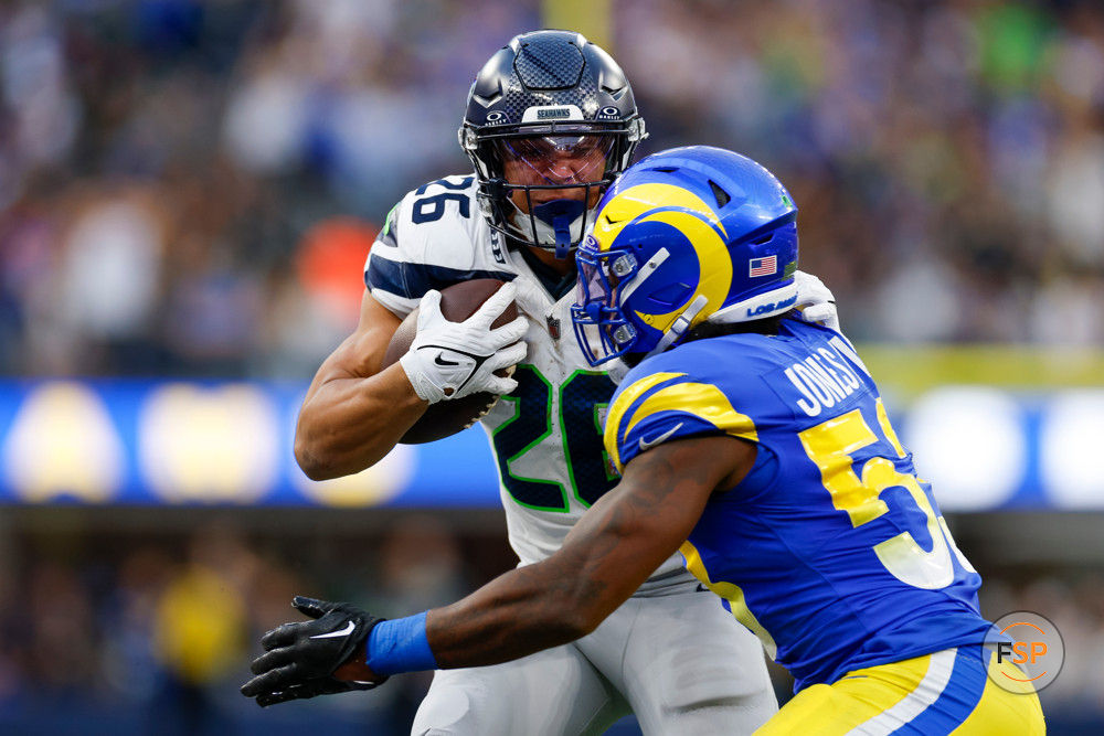 INGLEWOOD, CA - NOVEMBER 19: Seattle Seahawks running back Zach Charbonnet (26) runs with the ball during an NFL regular season game between the Seattle Seahawks and the Los Angeles Rams on November 19, 2023, at SoFi Stadium in Inglewood, CA. (Photo by Brandon Sloter/Icon Sportswire)