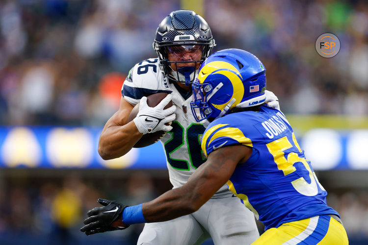 INGLEWOOD, CA - NOVEMBER 19: Seattle Seahawks running back Zach Charbonnet (26) runs with the ball during an NFL regular season game between the Seattle Seahawks and the Los Angeles Rams on November 19, 2023, at SoFi Stadium in Inglewood, CA. (Photo by Brandon Sloter/Icon Sportswire)