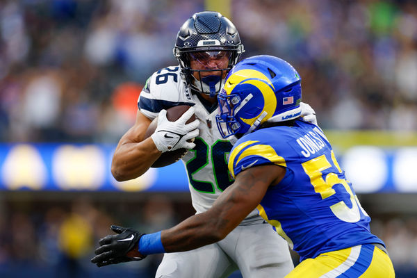 INGLEWOOD, CA - NOVEMBER 19: Seattle Seahawks running back Zach Charbonnet (26) runs with the ball during an NFL regular season game between the Seattle Seahawks and the Los Angeles Rams on November 19, 2023, at SoFi Stadium in Inglewood, CA. (Photo by Brandon Sloter/Icon Sportswire)