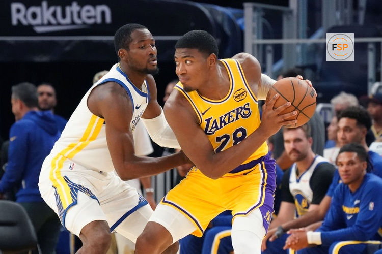 Oct 5, 2025; San Francisco, California, USA;  Los Angeles Lakers forward Rui Hachimura (28) is defended by Golden State Warriors forward Jonathan Kuminga (1) in the third quarter at Chase Center. Credit: David Gonzales-Imagn Images