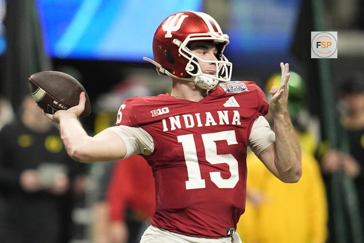 Jan 9, 2026; Atlanta, GA, USA; Indiana Hoosiers quarterback Fernando Mendoza (15) throws a pass against the Oregon Ducks during the third quarter of the 2025 Peach Bowl and semifinal game of the College Football Playoff at Mercedes-Benz Stadium. Credit: Dale Zanine-Imagn Images