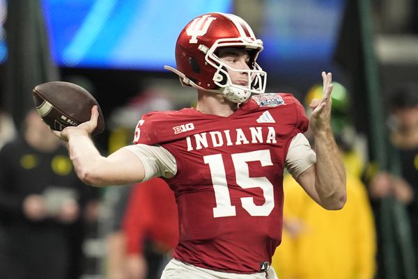 Jan 9, 2026; Atlanta, GA, USA; Indiana Hoosiers quarterback Fernando Mendoza (15) throws a pass against the Oregon Ducks during the third quarter of the 2025 Peach Bowl and semifinal game of the College Football Playoff at Mercedes-Benz Stadium. Mandatory Credit: Dale Zanine-Imagn Images