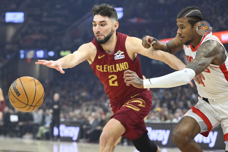 Jan 25, 2025; Cleveland, Ohio, USA; Cleveland Cavaliers guard Ty Jerome (2) and Houston Rockets guard Jalen Green (4) reach for a loose ball in the first quarter at Rocket Mortgage FieldHouse. Credit: David Richard-Imagn Images