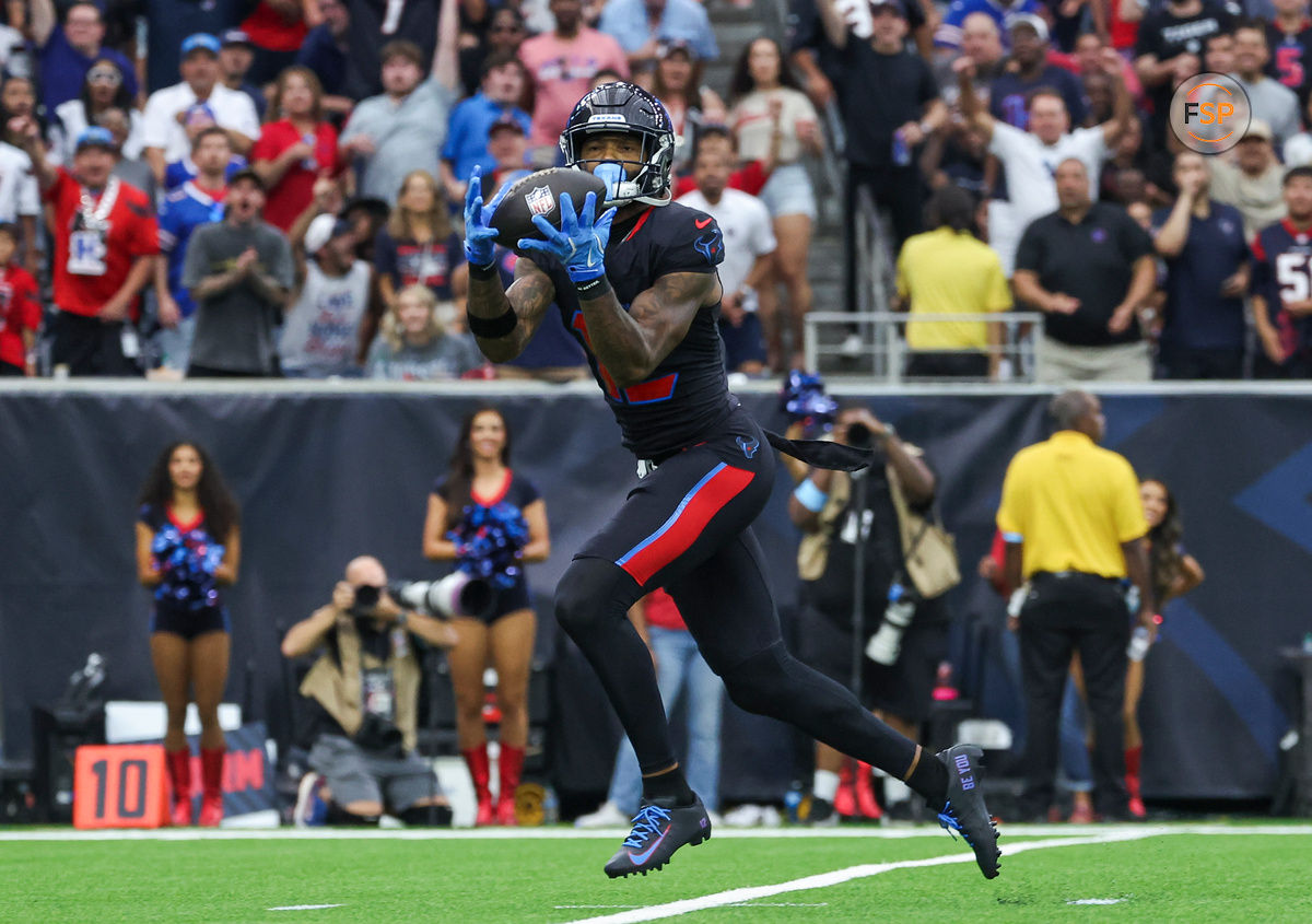 Oct 6, 2024; Houston, Texas, USA; Houston Texans wide receiver Nico Collins (12) makes a reception for a touchdown during the first quarter against the Buffalo Bills at NRG Stadium. Credit: Troy Taormina-Imagn Images