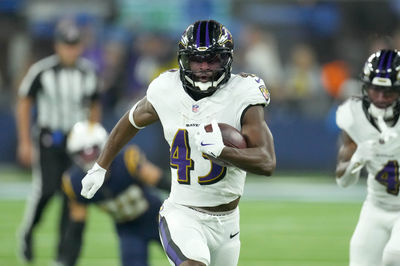 Nov 25, 2024; Inglewood, California, USA; Baltimore Ravens running back Justice Hill (43) scores on a 51-yard touchdown run in the fourth quarter against the Los Angeles Chargers at SoFi Stadium. Mandatory Credit: Kirby Lee-Imagn Images