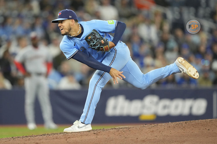 Apr 1, 2025; Toronto, Ontario, CAN; Toronto Blue Jays starting pitcher Jose Berrios (17) pitches to the Washington Nationals during the third inning at Rogers Centre. Credit: John E. Sokolowski-Imagn Images