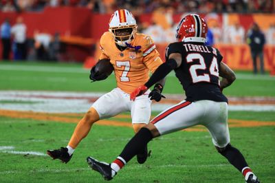 Dec 11, 2025; Tampa, Florida, USA; Tampa Bay Buccaneers running back Bucky Irving (7) runs the ball against Atlanta Falcons cornerback A.J. Terrell Jr. (24) during the second quarter at Raymond James Stadium. Mandatory Credit: Kim Klement Neitzel-Imagn Images