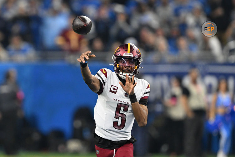 Jan 18, 2025; Detroit, Michigan, USA; Washington Commanders quarterback Jayden Daniels (5) throws a pass during the first quarter against Detroit Lions in a 2025 NFC divisional round game at Ford Field. Credit: Lon Horwedel-Imagn Images