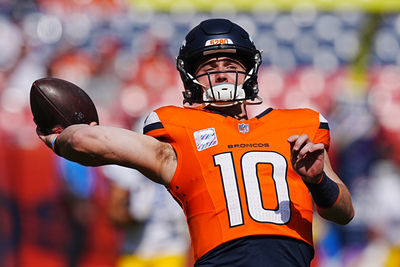 Oct 13, 2024; Denver, Colorado, USA; Denver Broncos quarterback Bo Nix (10) warms up before the game against the Los Angeles Chargers at Empower Field at Mile High. Mandatory Credit: Ron Chenoy-Imagn Images