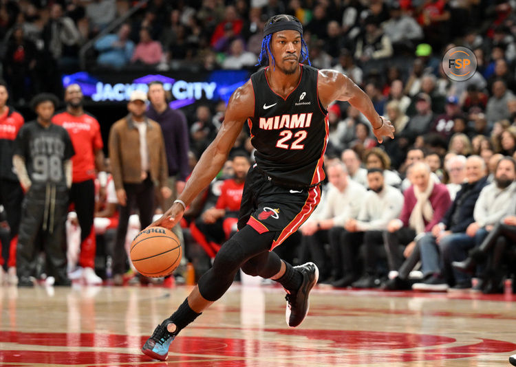 Dec 1, 2024; Toronto, Ontario, CAN;  Miami Heat forward Jimmy Butler (22) dribbles the ball against the Toronto Raptors in the first half at Scotiabank Arena. Credit: Dan Hamilton-Imagn Images