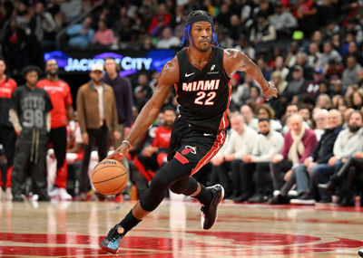 Dec 1, 2024; Toronto, Ontario, CAN;  Miami Heat forward Jimmy Butler (22) dribbles the ball against the Toronto Raptors in the first half at Scotiabank Arena. Mandatory Credit: Dan Hamilton-Imagn Images