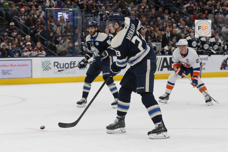 Apr 17, 2025; Columbus, Ohio, USA; Columbus Blue Jackets center Sean Monahan (23) passes the puck against the New York Islanders during the second period at Nationwide Arena. Credit: Russell LaBounty-Imagn Images