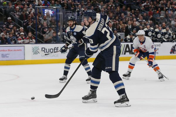 Apr 17, 2025; Columbus, Ohio, USA; Columbus Blue Jackets center Sean Monahan (23) passes the puck against the New York Islanders during the second period at Nationwide Arena. Mandatory Credit: Russell LaBounty-Imagn Images