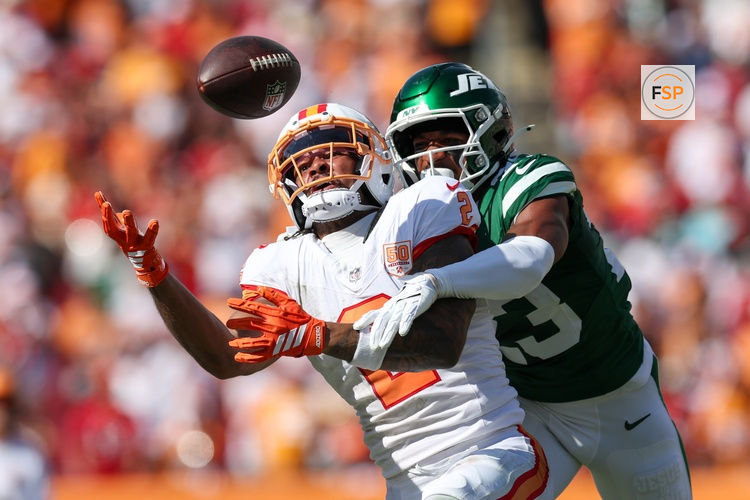 Sep 21, 2025; Tampa, Florida, USA; New York Jets cornerback Azareye'H Thomas (23) breaks up a pass to Tampa Bay Buccaneers wide receiver Emeka Egbuka (2) in the fourth quarter at Raymond James Stadium. Credit: Nathan Ray Seebeck-Imagn Images