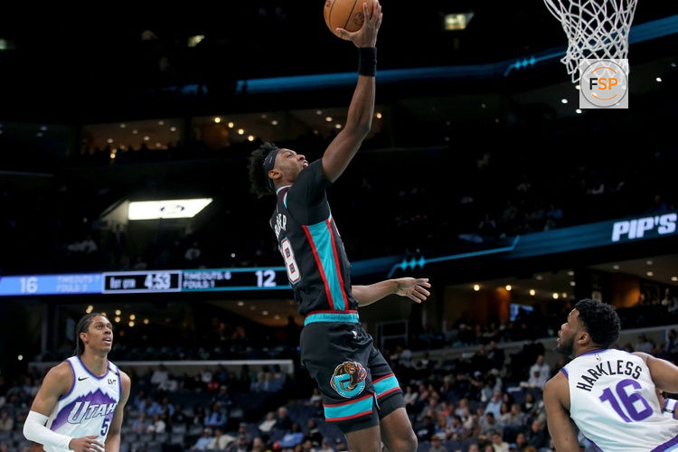 Feb 20, 2026; Memphis, Tennessee, USA; Memphis Grizzlies forward Olivier-Maxence Prosper (18) drives during the first quarter against the Utah Jazz at FedExForum. Credit: Petre Thomas-Imagn Images