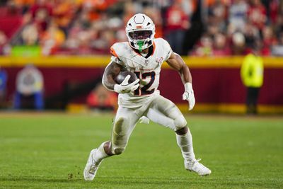 Dec 25, 2025; Kansas City, Missouri, USA; Denver Broncos running back RJ Harvey (12) runs with the ball during the second half against the Kansas City Chiefs at GEHA Field at Arrowhead Stadium. Mandatory Credit: Jay Biggerstaff-Imagn Images