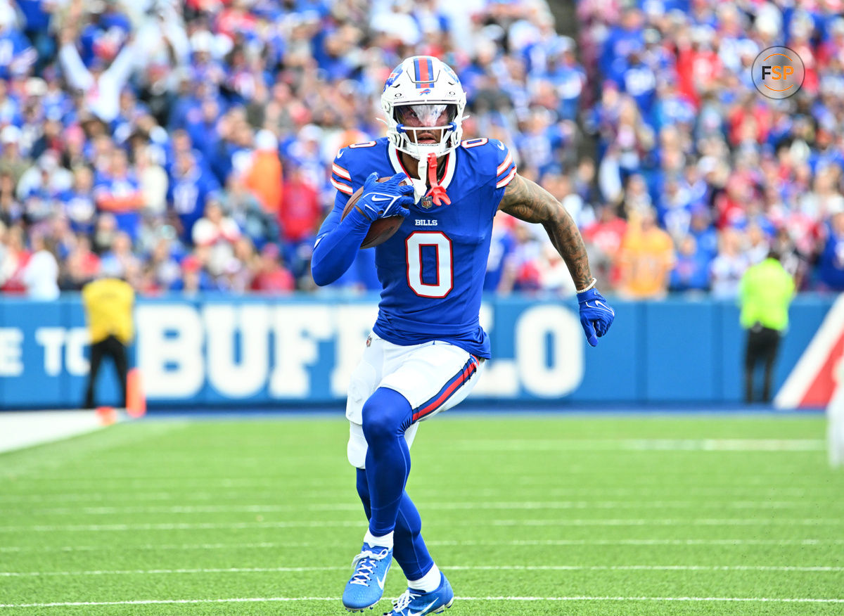 Sep 8, 2024; Orchard Park, New York, USA; Buffalo Bills wide receiver Keon Coleman (0) runs for a first down after a catch against the Arizona Cardinals in the second quarter at Highmark Stadium. Credit: Mark Konezny-Imagn Images