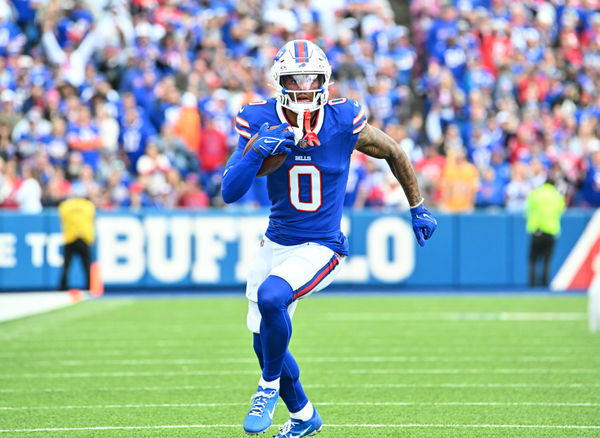 Sep 8, 2024; Orchard Park, New York, USA; Buffalo Bills wide receiver Keon Coleman (0) runs for a first down after a catch against the Arizona Cardinals in the second quarter at Highmark Stadium. Mandatory Credit: Mark Konezny-Imagn Images