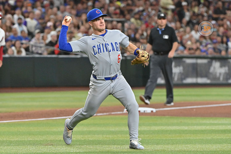 Mar 28, 2025; Phoenix, Arizona, USA;  Chicago Cubs second base Matt Shaw (6) fields a bunt in the fourth inning against the Arizona Diamondbacks at Chase Field. Credit: Matt Kartozian-Imagn Images