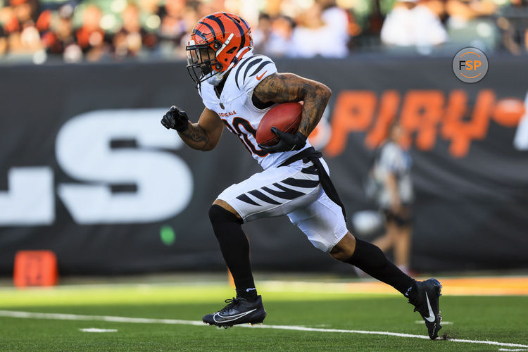 Aug 10, 2024; Cincinnati, Ohio, USA; Cincinnati Bengals running back Chase Brown (30) runs with the ball against the Tampa Bay Buccaneers in the first half at Paycor Stadium. Credit: Katie Stratman-USA TODAY Sports