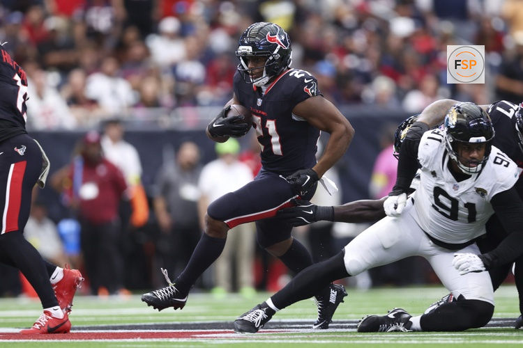 Nov 9, 2025; Houston, Texas, USA; Houston Texans running back Nick Chubb (21) runs with the ball during the game against the Jacksonville Jaguars at NRG Stadium. Credit: Troy Taormina-Imagn Images