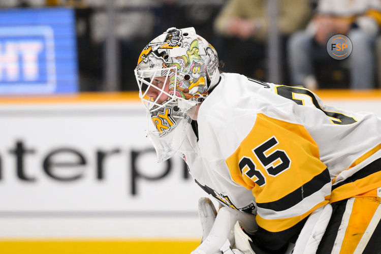 Dec 19, 2024; Nashville, Tennessee, USA;  Pittsburg Penguins goaltender Tristan Jarry (35) awaits the face off against the Nashville Predators during the first period at Bridgestone Arena. Credit: Steve Roberts-Imagn Images