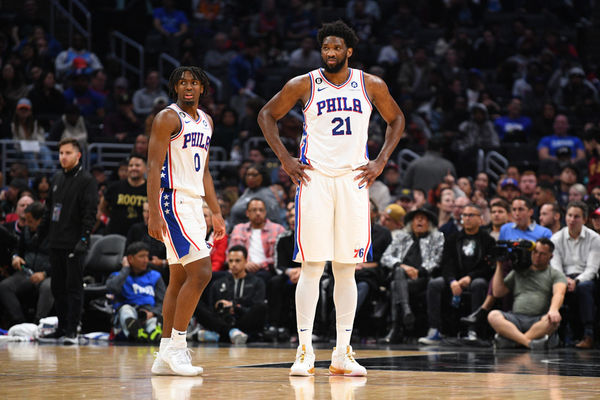 LOS ANGELES, CA - JANUARY 17: Philadelphia 76ers Center Joel Embiid (21) and Philadelphia 76ers Guard Tyrese Maxey (0) look on during a NBA game between the Philadelphia 76ers and the Los Angeles Clippers on January 17, 2023 at Crypto.com Arena in Los Angeles, CA. (Photo by Brian Rothmuller/Icon Sportswire)