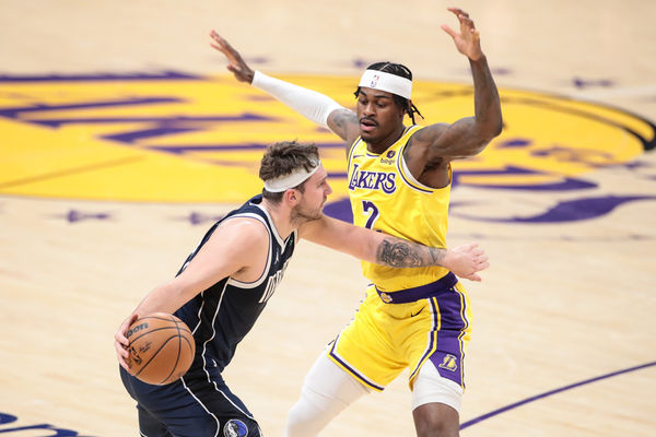 LOS ANGELES, CA - JANUARY 17: Dallas Mavericks guard Luka Doncic (77) looks to pass Los Angeles Lakers forward Jarred Vanderbilt (2) during the NBA game between the Dallas Mavericks and Los Angeles Lakers on January 17. 2024, at Crypto.com Arena in Los Angeles, CA.  (Photo by Jevone Moore/Icon Sportswire)