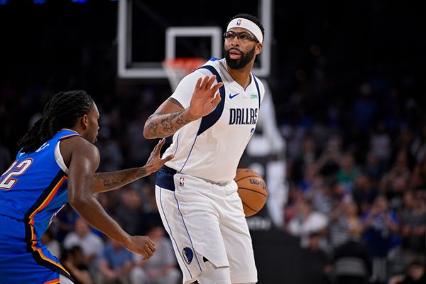 Oct 6, 2025; Fort Worth, Texas, USA; Dallas Mavericks forward/center Anthony Davis (3) sets the play against Oklahoma City Thunder guard Cason Wallace (22) during the game between the Dallas Mavericks and the Oklahoma City Thunder at Dickie's Arena. Mandatory Credit: Jerome Miron-Imagn Images