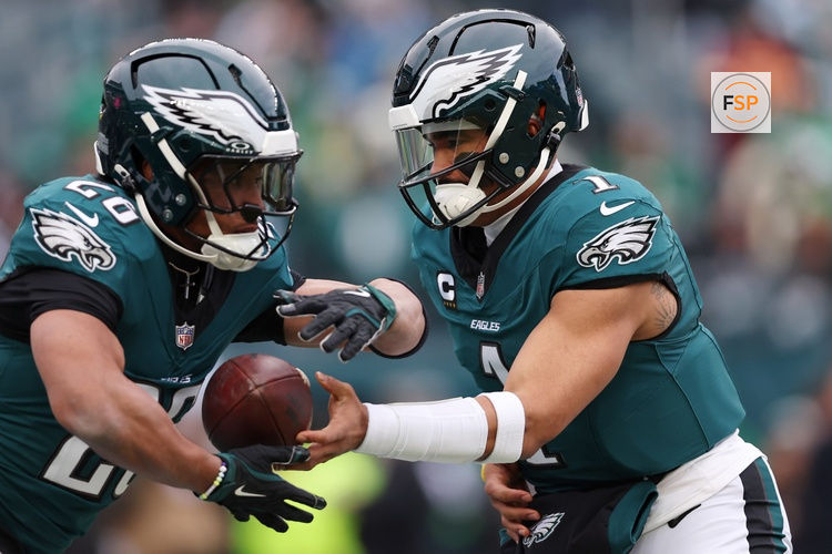 Jan 26, 2025; Philadelphia, PA, USA; Philadelphia Eagles quarterback Jalen Hurts (1) and running back Saquon Barkley (26) warm up before the NFC Championship game at Lincoln Financial Field. Credit: Bill Streicher-Imagn Images