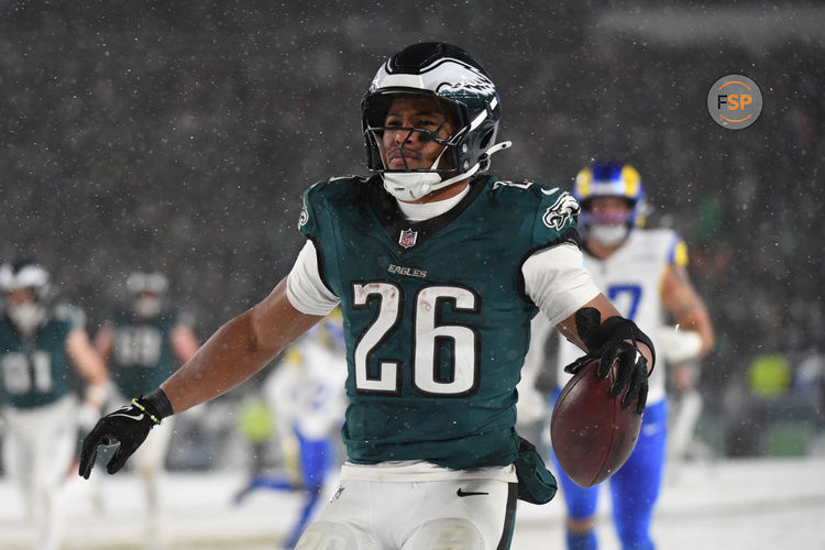 Jan 19, 2025; Philadelphia, Pennsylvania, USA; Philadelphia Eagles running back Saquon Barkley (26) celebrates after scoring a touchdown against the Los Angeles Rams in the second half in a 2025 NFC divisional round game at Lincoln Financial Field. Credit: Eric Hartline-Imagn Images