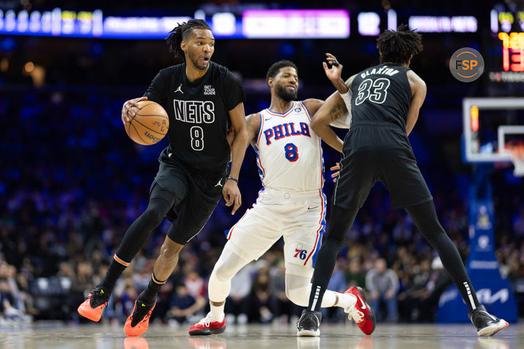 Feb 22, 2025; Philadelphia, Pennsylvania, USA; Brooklyn Nets forward Ziaire Williams (8) dribbles around Philadelphia 76ers forward Paul George (8) on the pick by center Nic Claxton (33) during the first quarter at Wells Fargo Center. Credit: Bill Streicher-Imagn Images