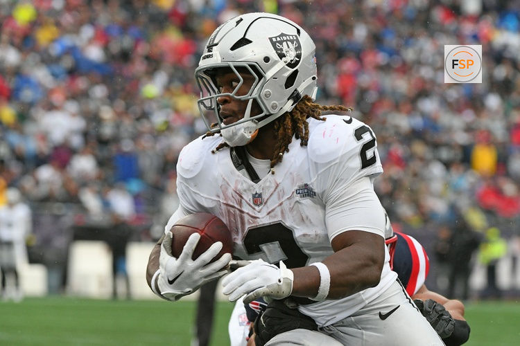 Sep 7, 2025; Foxborough, Massachusetts, USA; Las Vegas Raiders running back Ashton Jeanty (2) rushes the ball against the New England Patriots during the second half at Gillette Stadium. Credit: Bob DeChiara-Imagn Images