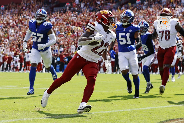 Sep 7, 2025; Landover, Maryland, USA; Washington Commanders running back Jacory Croskey-Merritt (22) scores a touchdown during the second quarter against the New York Giants at Northwest Stadium. Credit: Peter Casey-Imagn Images