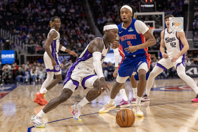 Jan 25, 2026; Detroit, Michigan, USA; Detroit Pistons forward Ronald Holland II (5) defends against Sacramento Kings guard Dennis Schroder (17) during the first half at Little Caesars Arena. Credit: David Reginek-Imagn Images