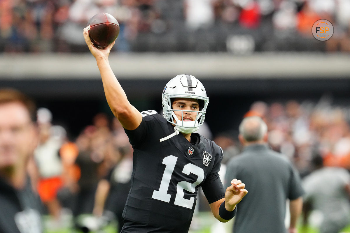 Sep 29, 2024; Paradise, Nevada, USA; Las Vegas Raiders quarterback Aidan O'Connell (12) warms up before a game against the Cleveland Browns at Allegiant Stadium. Credit: Stephen R. Sylvanie-Imagn Images