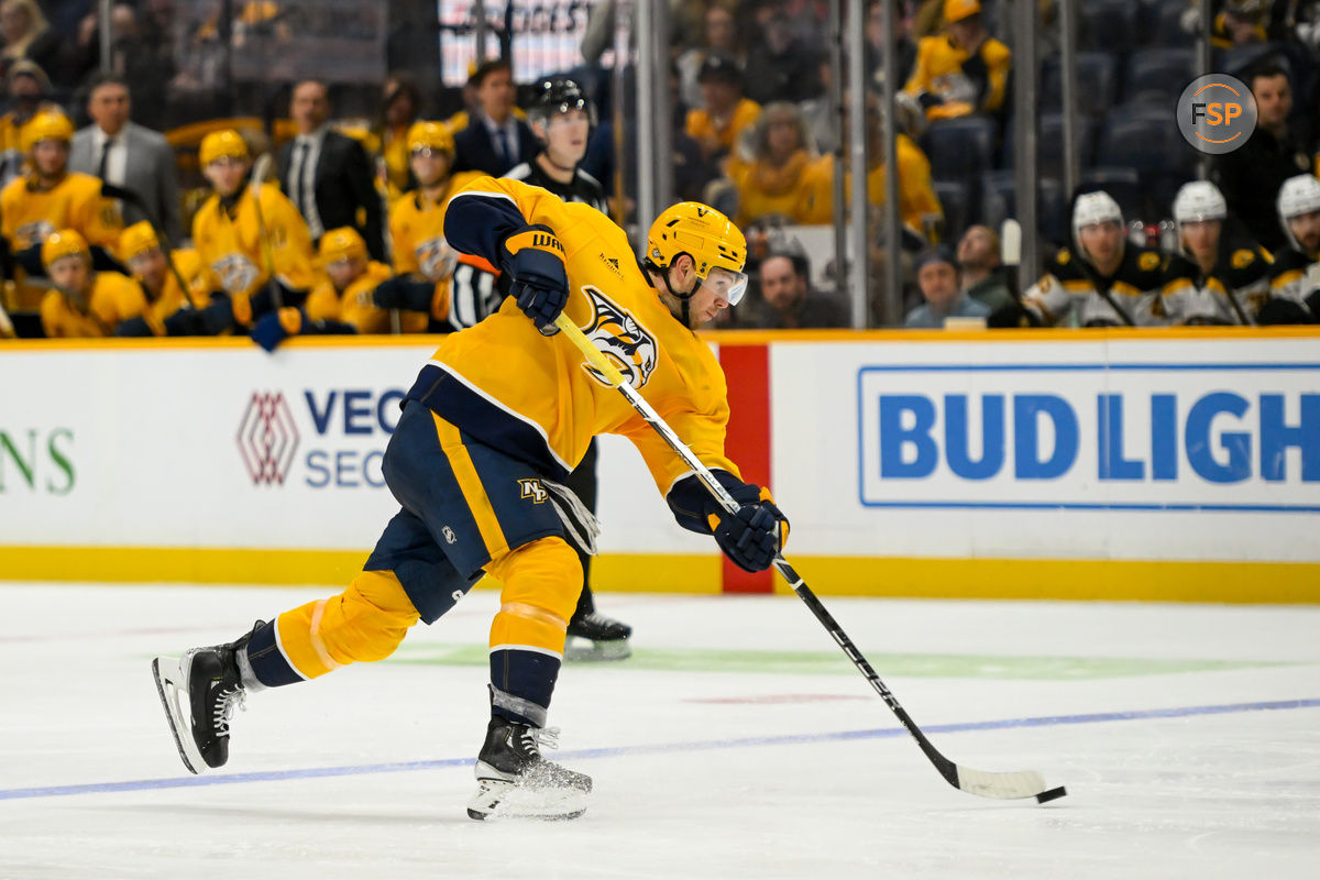 Oct 22, 2024; Nashville, Tennessee, USA;  Nashville Predators center Ryan O'Reilly (90) takes a shot against against the Boston Bruins during the third period at Bridgestone Arena. Credit: Steve Roberts-Imagn Images