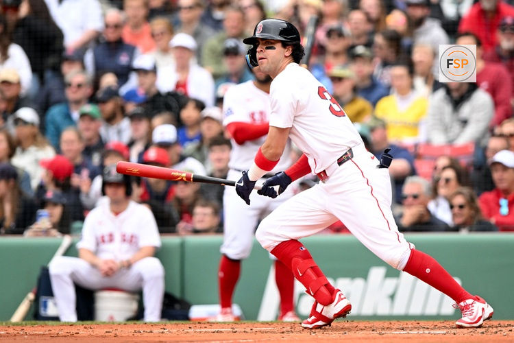 May 25, 2025; Boston, Massachusetts, USA; Boston Red Sox shortstop Marcelo Mayer (39) hits a single against the Baltimore Orioles for his first MLB hit during the second inning at Fenway Park. Credit: Brian Fluharty-Imagn Images