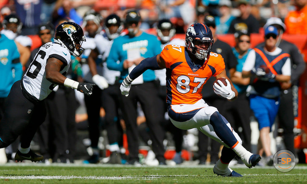 DENVER, CO - SEPTEMBER 29:  Tight end Noah Fant #87 of the Denver Broncos runs with the football past linebacker Quincy Williams #56 of the Jacksonville Jaguars on his way to a touchdown during the first quarter at Empower Field at Mile High on September 29, 2019 in Denver, Colorado. (Photo by Justin Edmonds/Getty Images)