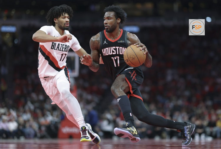 Nov 14, 2025; Houston, Texas, USA;  Houston Rockets forward Tari Eason (17) drives with the ball as Portland Trail Blazers guard Shaedon Sharpe (17) defends during the second quarter at Toyota Center. Credit: Troy Taormina-Imagn Images