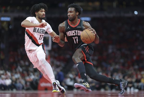 Nov 14, 2025; Houston, Texas, USA;  Houston Rockets forward Tari Eason (17) drives with the ball as Portland Trail Blazers guard Shaedon Sharpe (17) defends during the second quarter at Toyota Center. Mandatory Credit: Troy Taormina-Imagn Images
