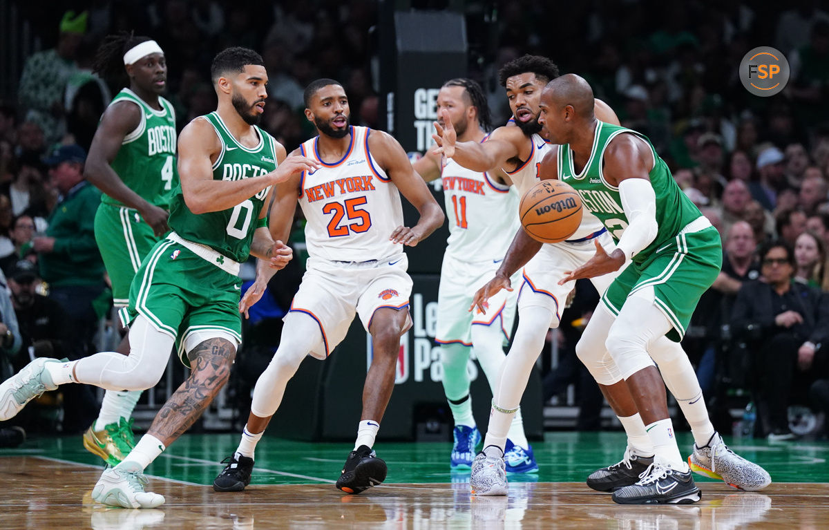 Oct 22, 2024; Boston, Massachusetts, USA; Boston Celtics center Al Horford (42) hands off the ball to forward Jayson Tatum (0) against the New York Knicks in the second half at TD Garden. Credit: David Butler II-Imagn Images