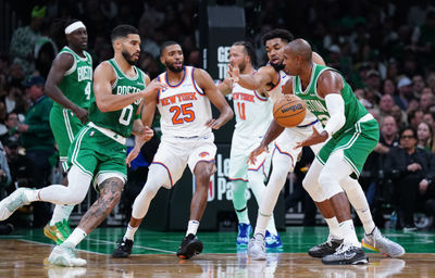 Oct 22, 2024; Boston, Massachusetts, USA; Boston Celtics center Al Horford (42) hands off the ball to forward Jayson Tatum (0) against the New York Knicks in the second half at TD Garden. Mandatory Credit: David Butler II-Imagn Images