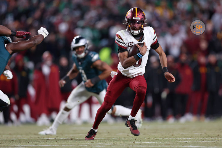 Jan 26, 2025; Philadelphia, PA, USA; Washington Commanders quarterback Jayden Daniels (5) runs with the ball against the Philadelphia Eagles during the second half in the NFC Championship game at Lincoln Financial Field. Credit: Bill Streicher-Imagn Images