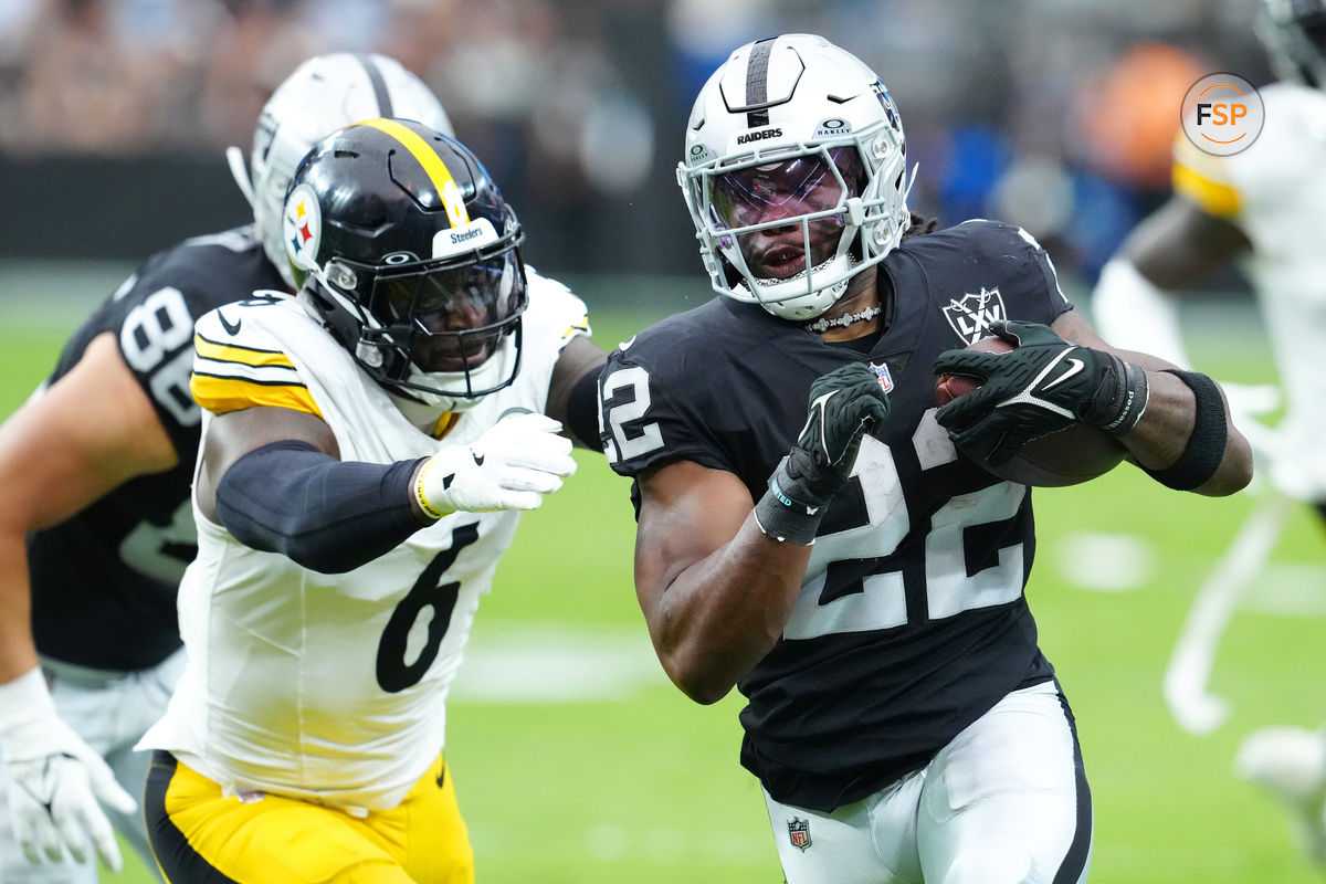 Oct 13, 2024; Paradise, Nevada, USA; Las Vegas Raiders running back Alexander Mattison (22) looks to evade the tackle attempt of Pittsburgh Steelers linebacker Patrick Queen (6) during the first quarter at Allegiant Stadium. Credit: Stephen R. Sylvanie-Imagn Images